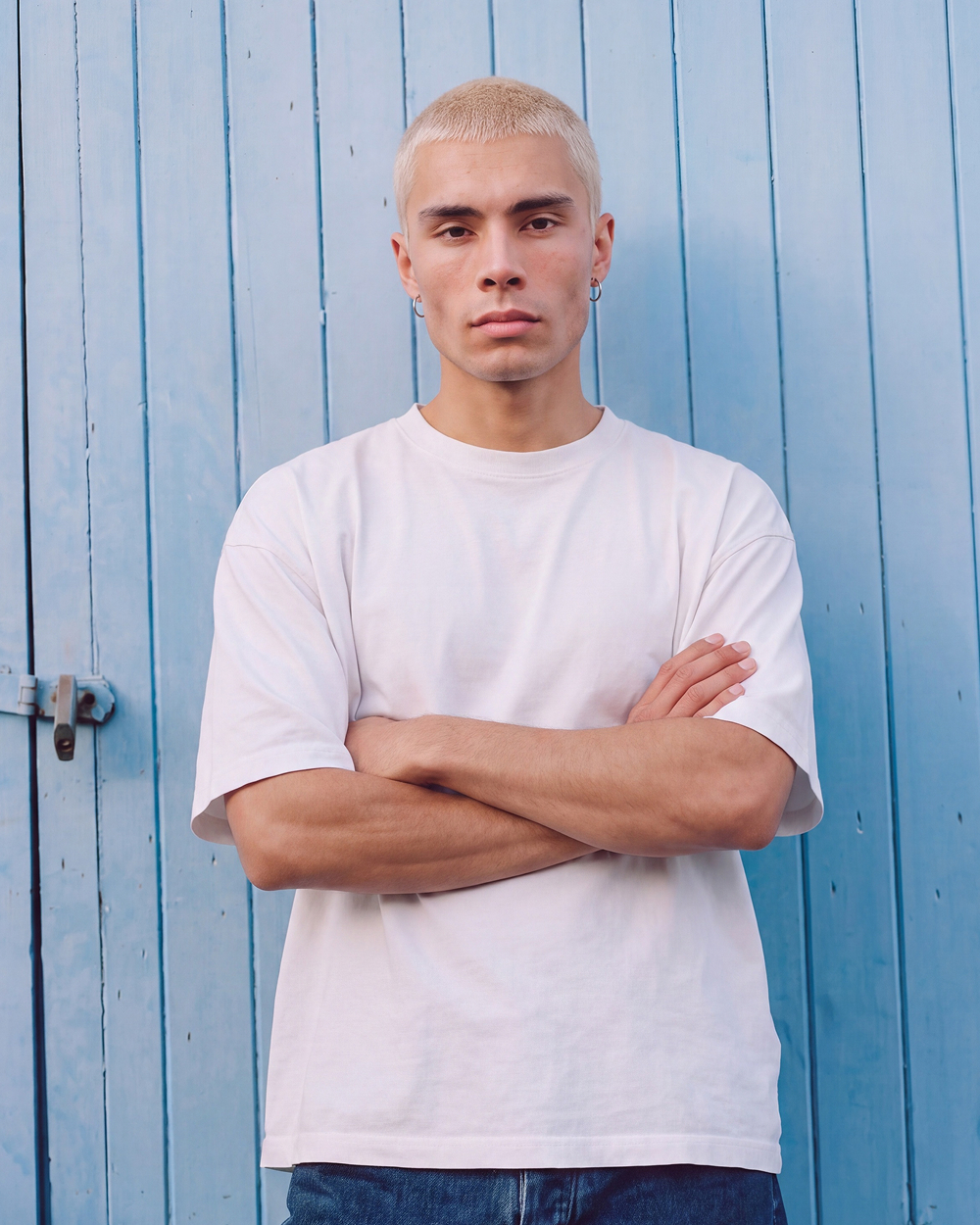 blonde man arms crossed