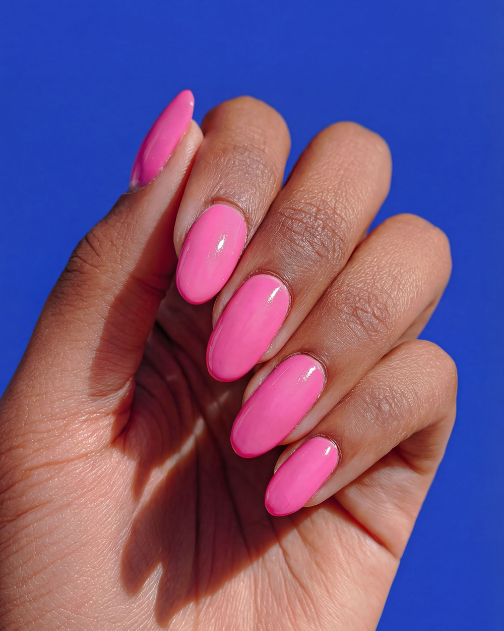 pink nails blue background