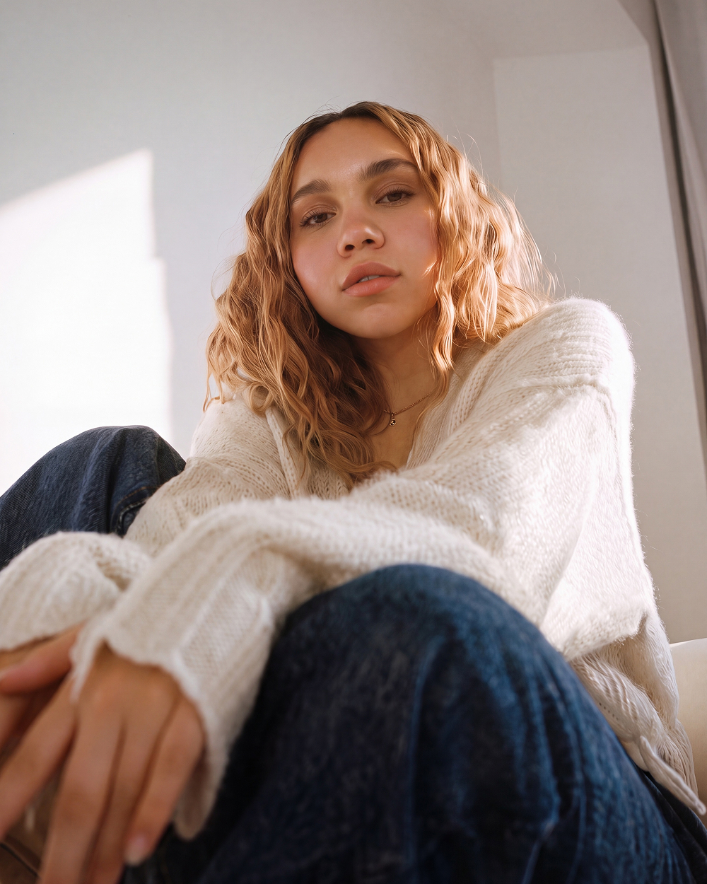 white sweater curly hair